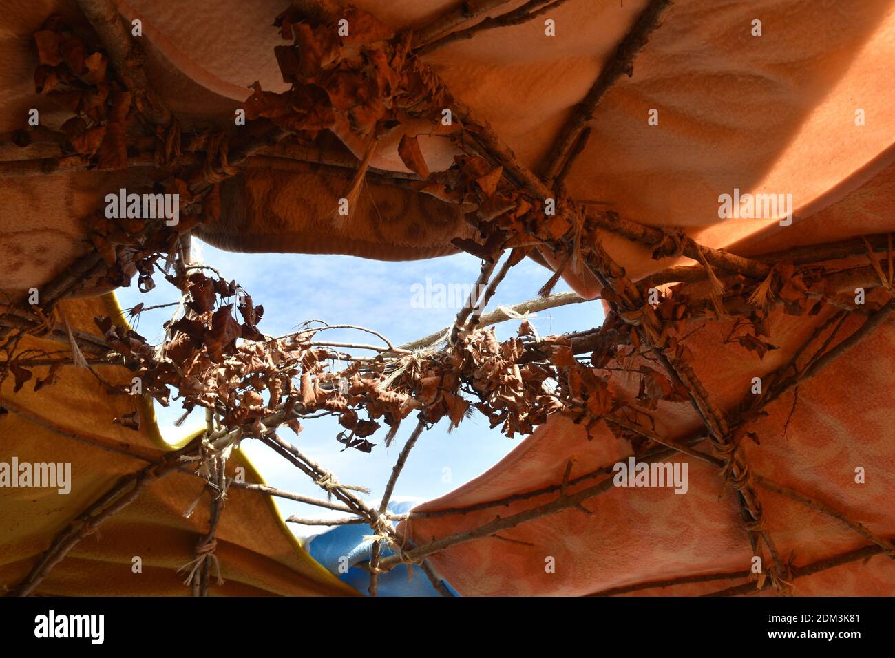 Inipi lakota of poplar branches covered with blankets and a hole in the upper part. Stock Photo