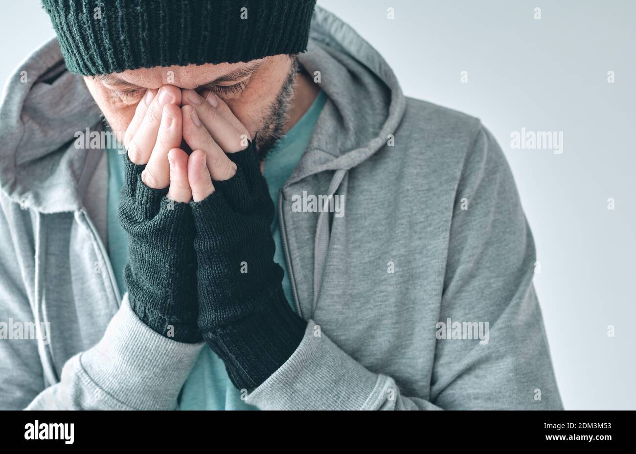 Letdown disappointed casual male in disbelief, adult caucasian male overwhelmed by disappointment looking down and sulking Stock Photo