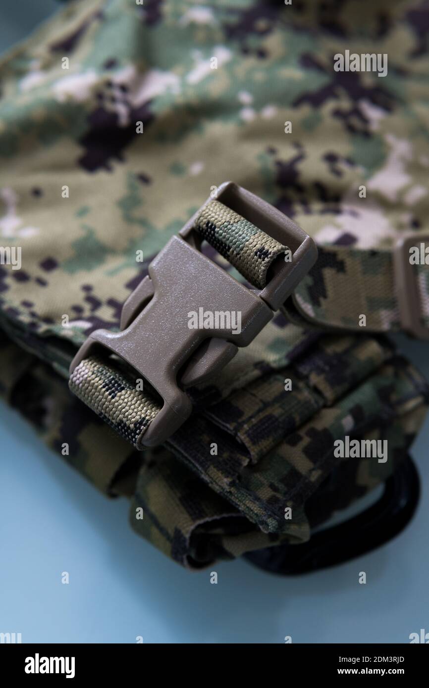 A vertical closeup shot of a clasp on military gear Stock Photo