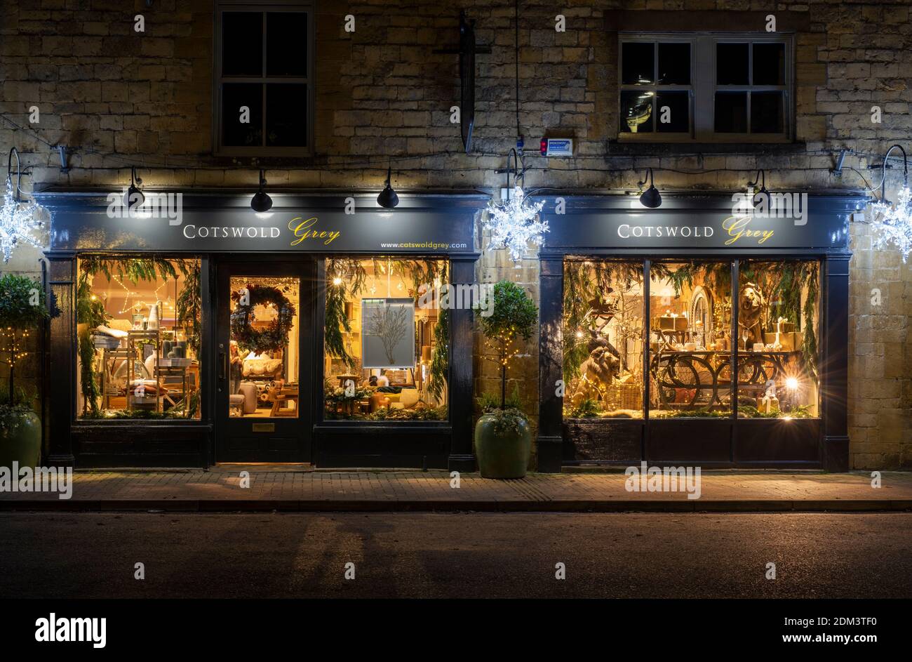 Cotswold Grey shop after dark at christmas. Moreton in Marsh, Cotswolds