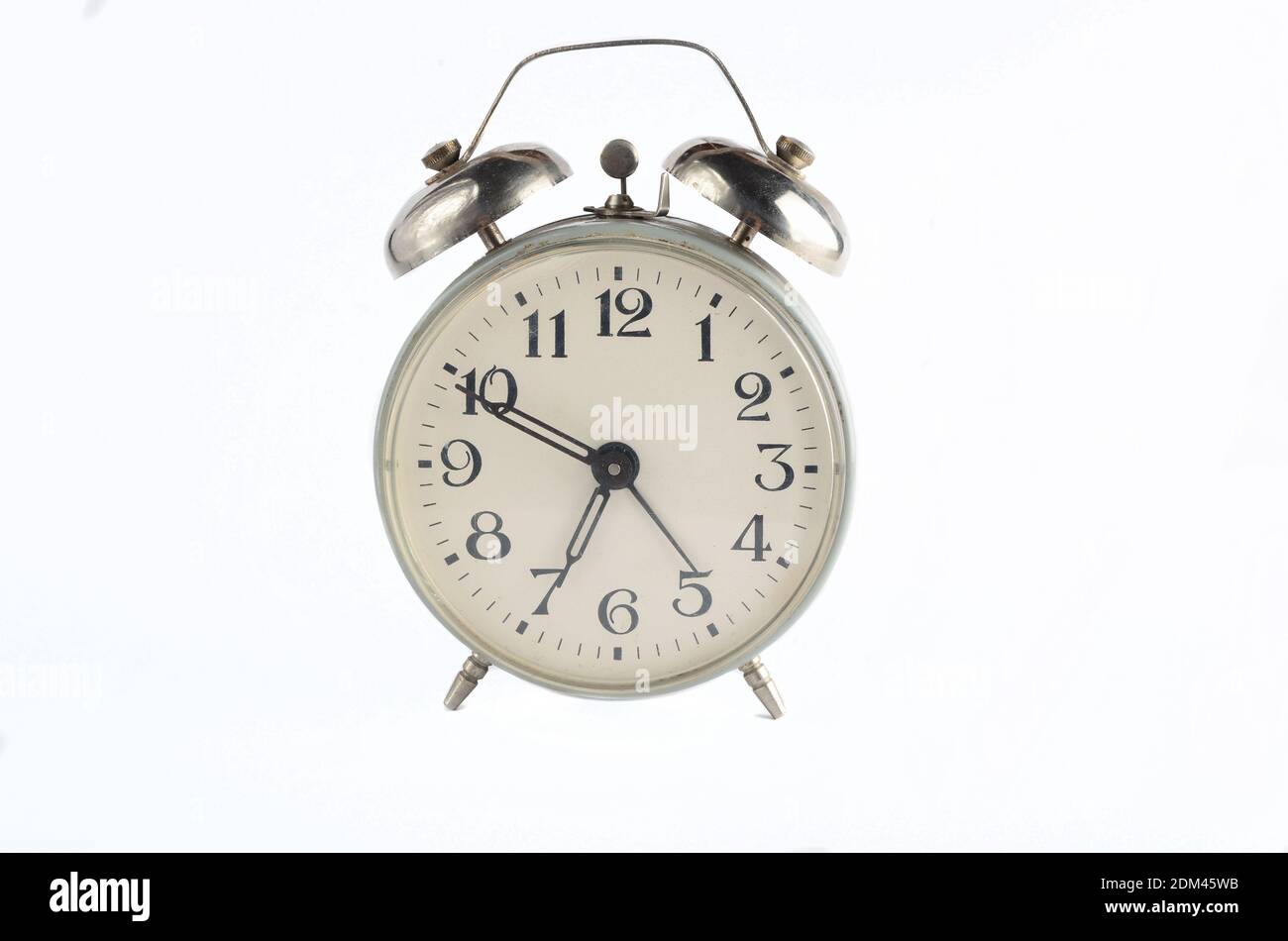 Retro metal alarm clock isolated on white. Morning time, time to get up