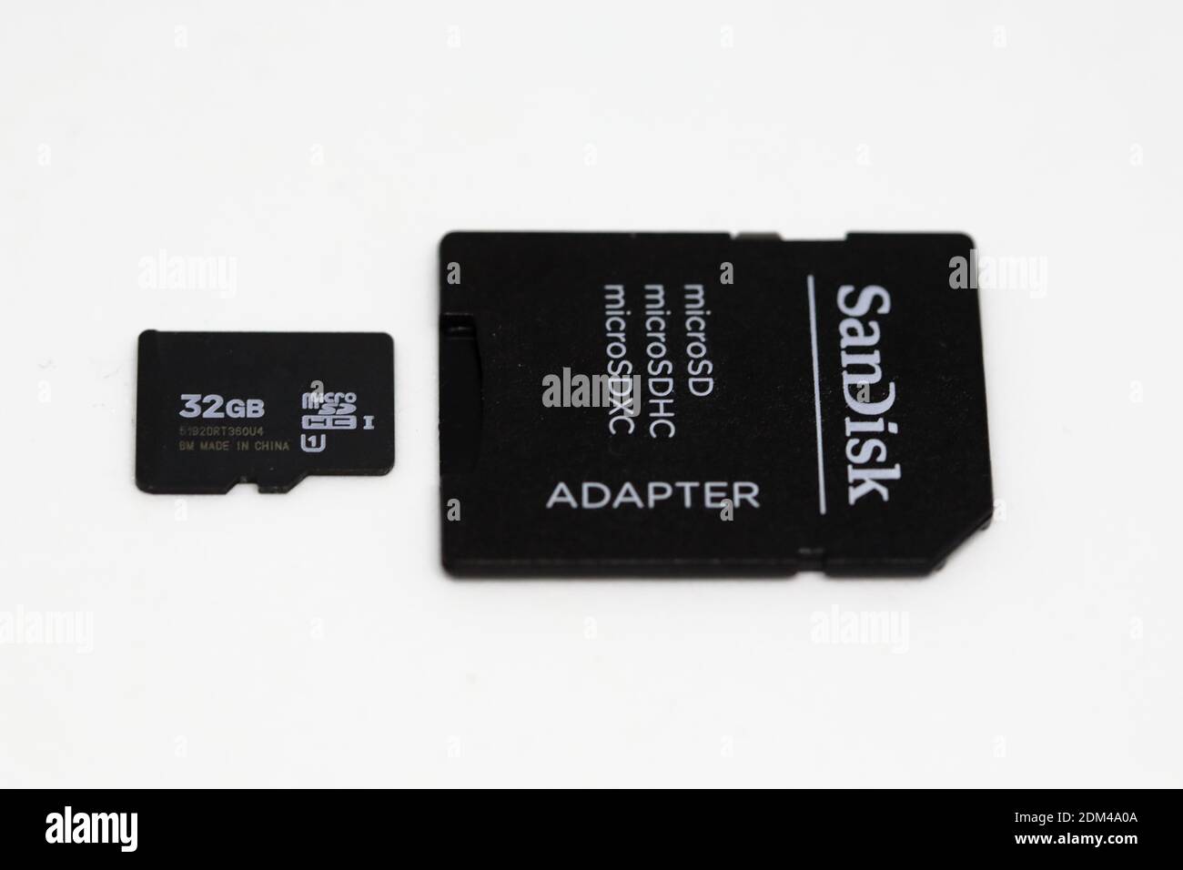 A micro SD  card  and its adapter showing their upper sides Stock Photo