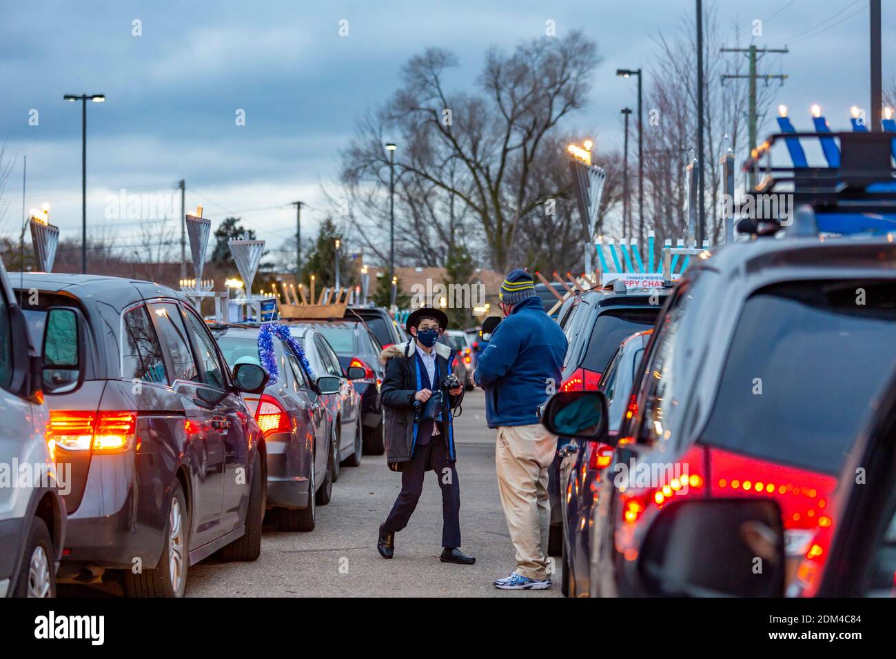 Southfield, Michigan - Cars line up for a Car Top Menorah Parade on the fourth night of Chanukah. Stock Photo