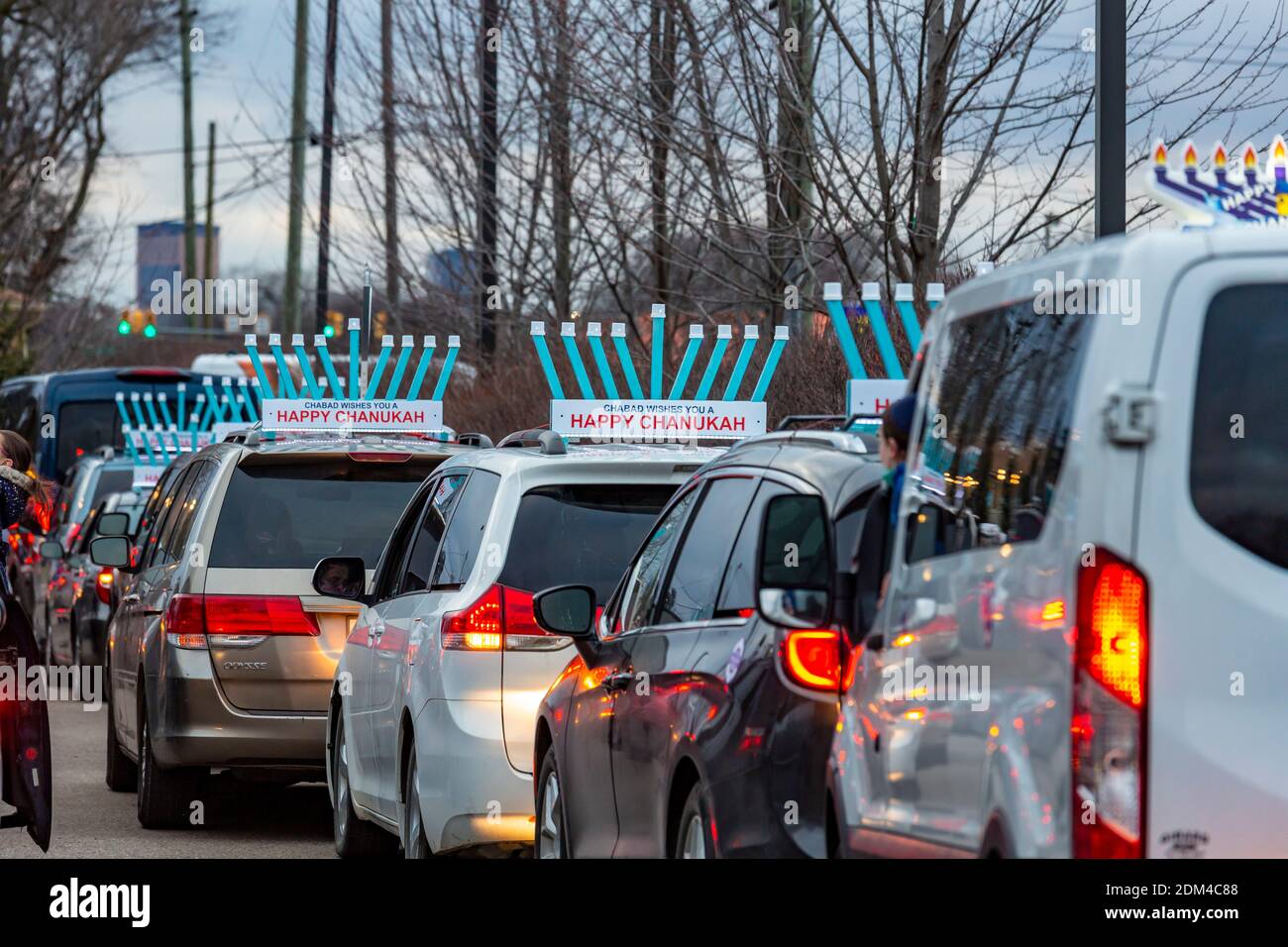 Southfield, Michigan - Cars line up for a Car Top Menorah Parade on the fourth night of Chanukah. Stock Photo