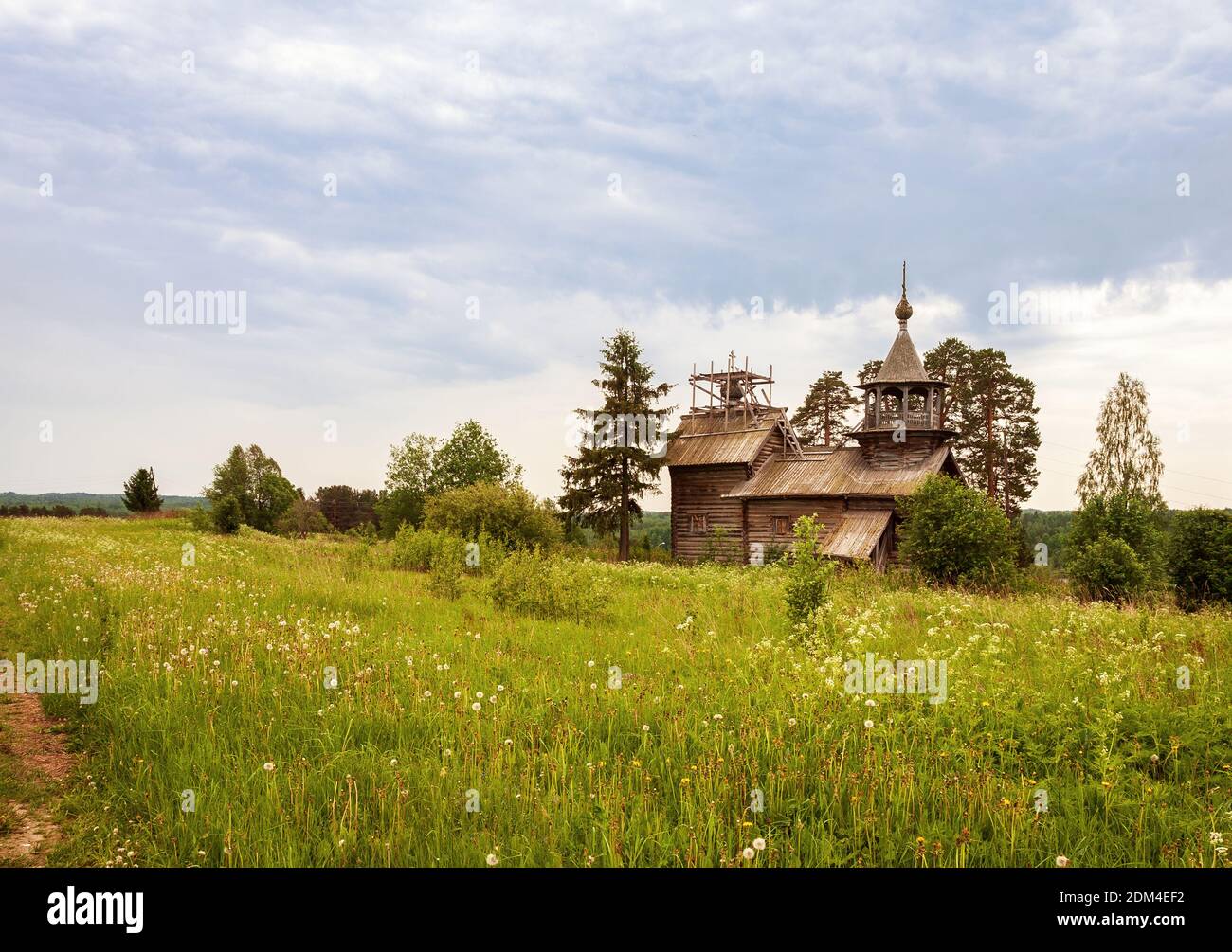 Summer landscape with old wooden chapel in Manga village, Karelia, Russia Stock Photo