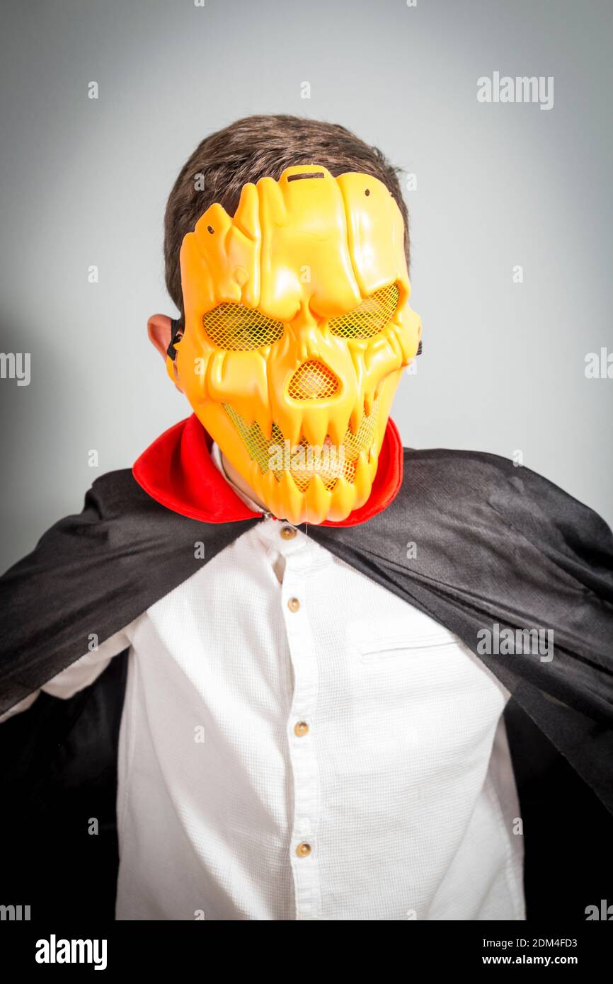 Boy Wearing Vampire Mask Against Gray Background Stock Photo Alamy