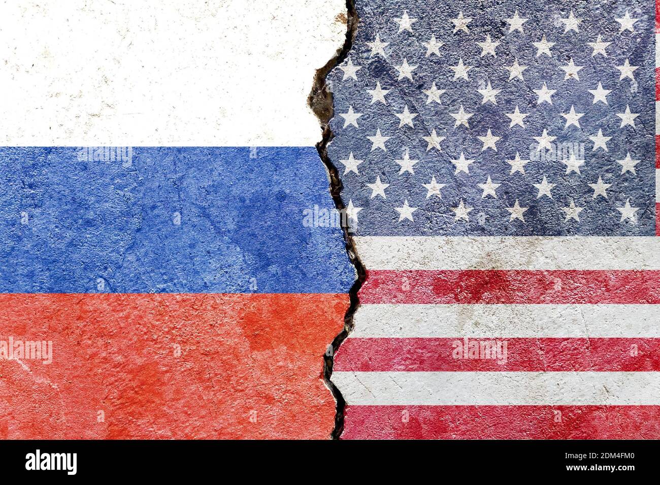 A Russian and EU flag on a cracked wall- politics, war, conflict concept Stock Photo