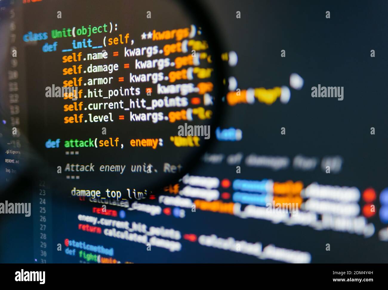 Program code on computer display in magnifying glass. Close-up. High quality photo Stock Photo