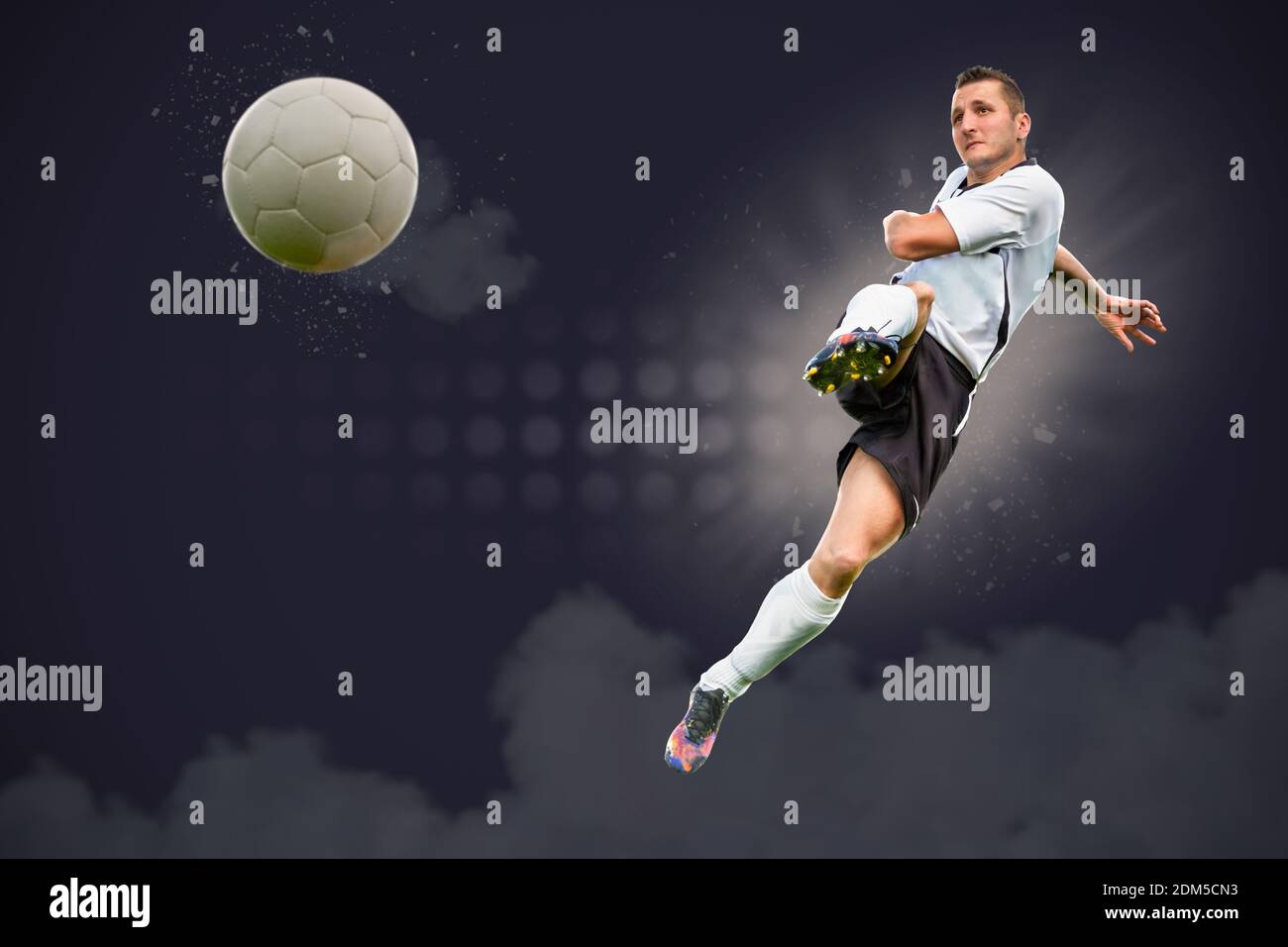Digital Composite Image Of Player Kicking Soccer Ball Against Sky Stock Photo Alamy