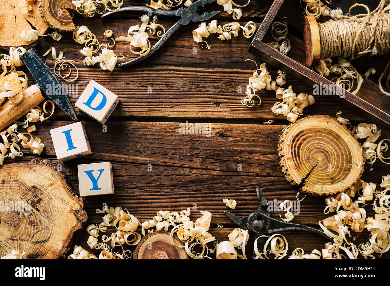 DIY wood. Woodworking workshop. Wood shavings and carpentry tools. background Stock Photo