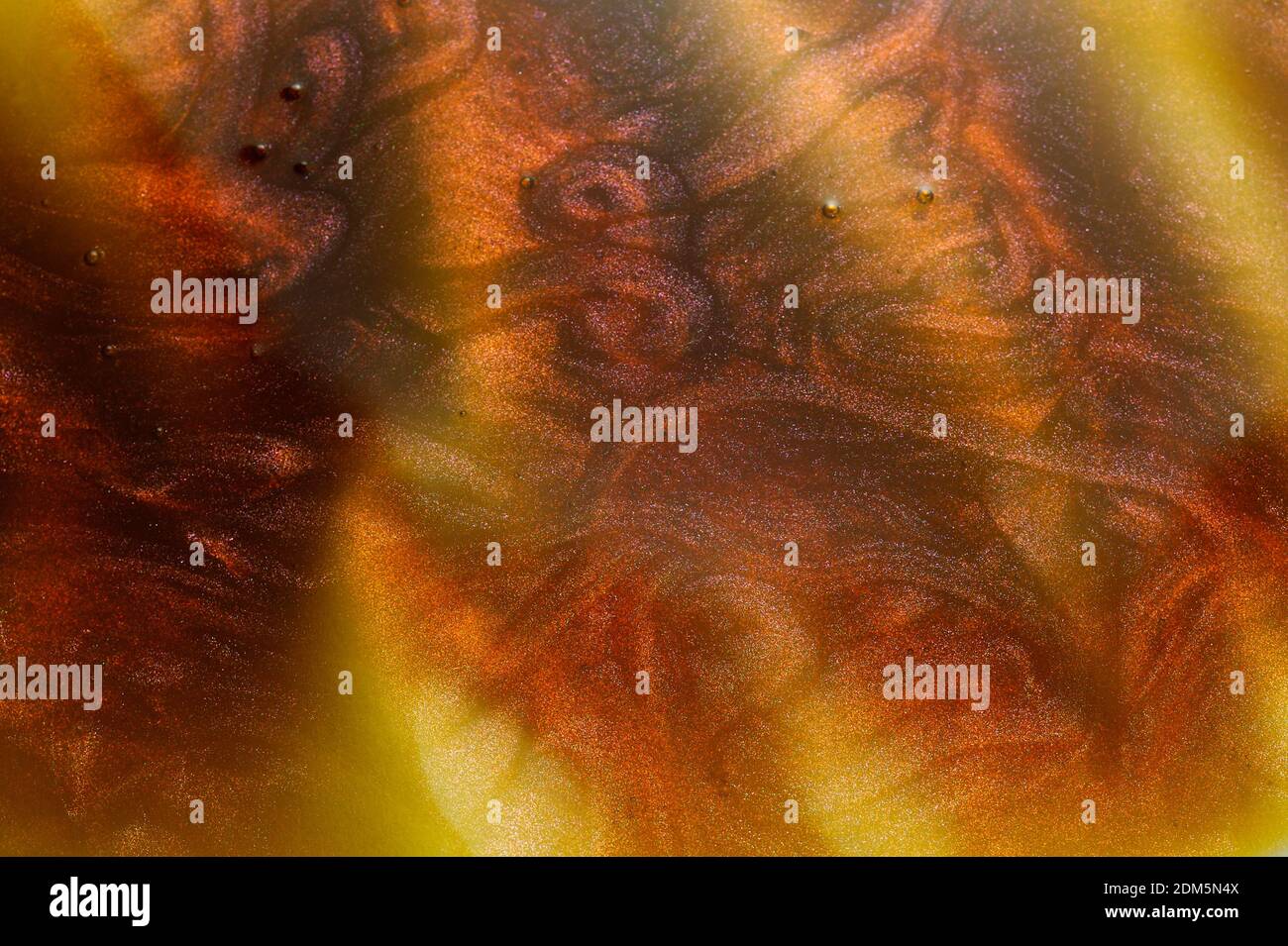 Used motor oil with small metallic particles spill on floor. Greasy