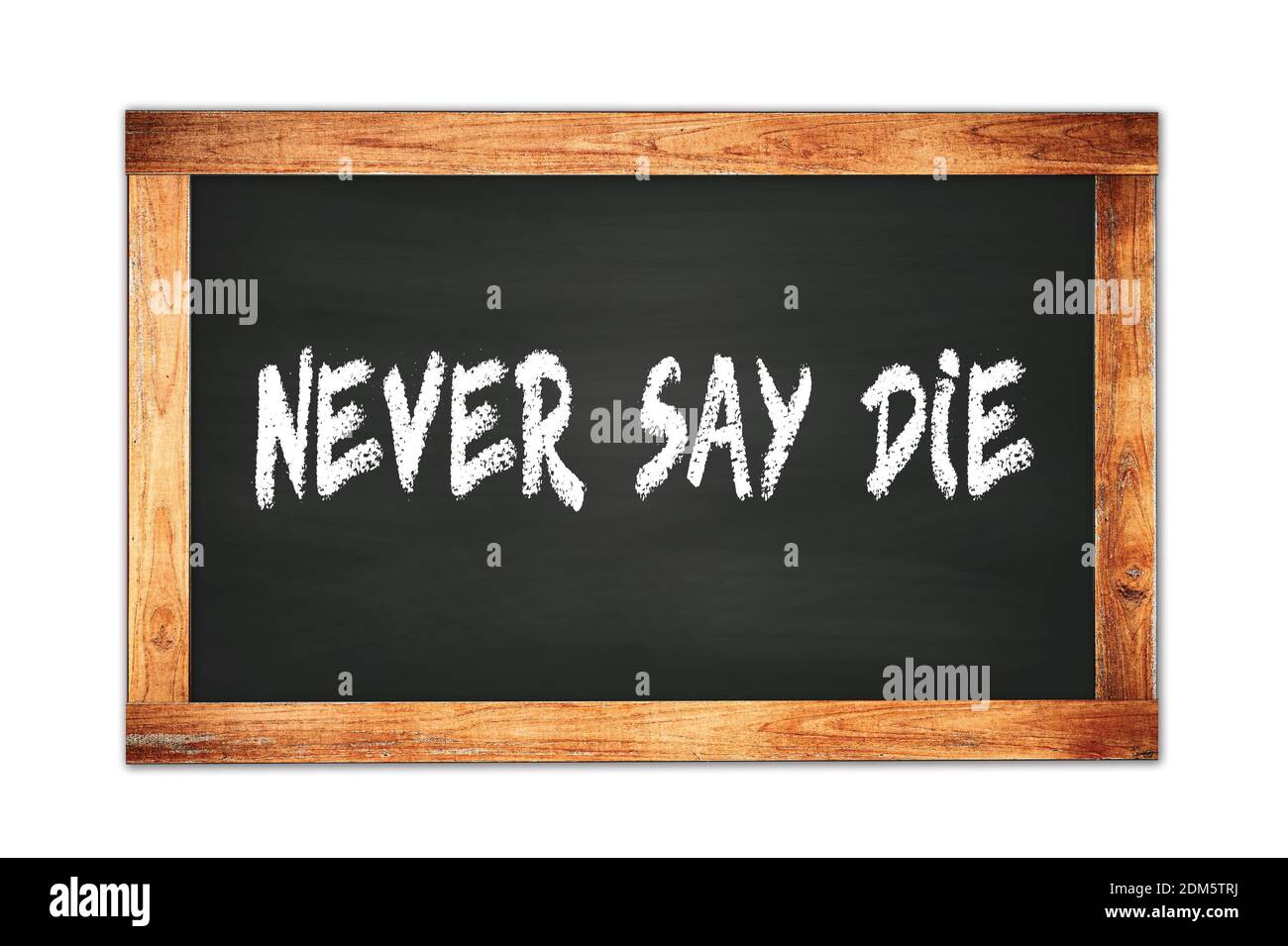 NEVER  SAY  DIE text written on black wooden frame school blackboard. Stock Photo