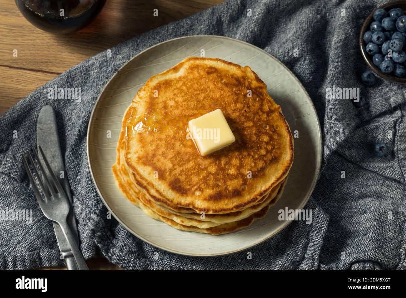 Homemade Sourdough Pancakes with Butter and Blueberries Stock Photo