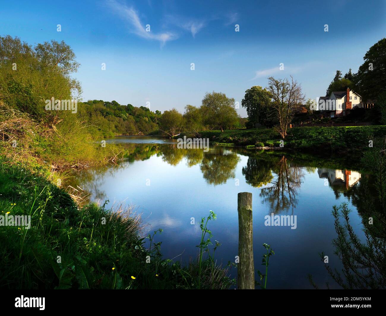 The River Wye above Hereford at Stretton Sugwas is picturesque, supporting orchards and flora. Stock Photo
