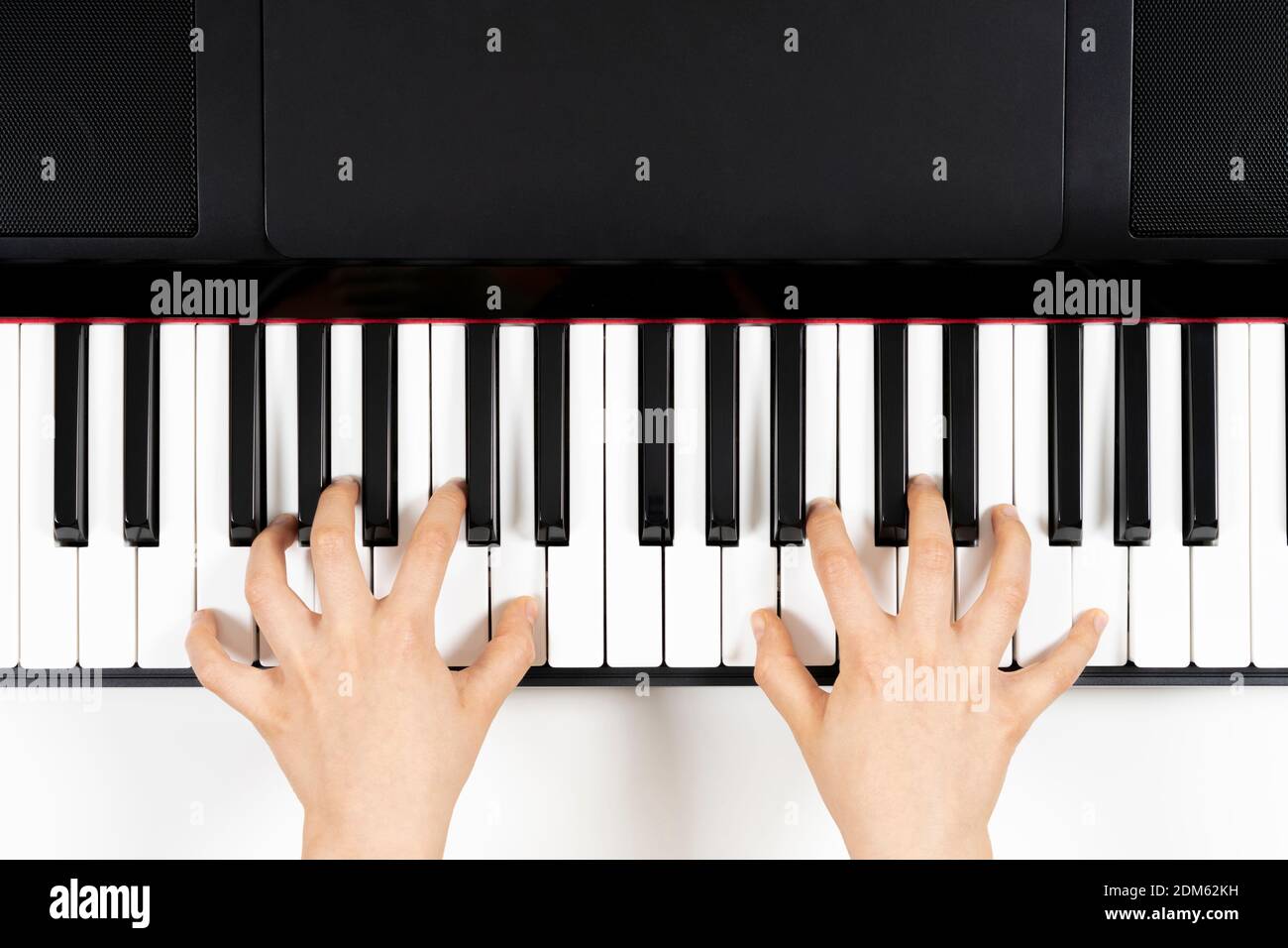 Kid Hands Learning To Play On The Piano Top View Stock Photo Alamy