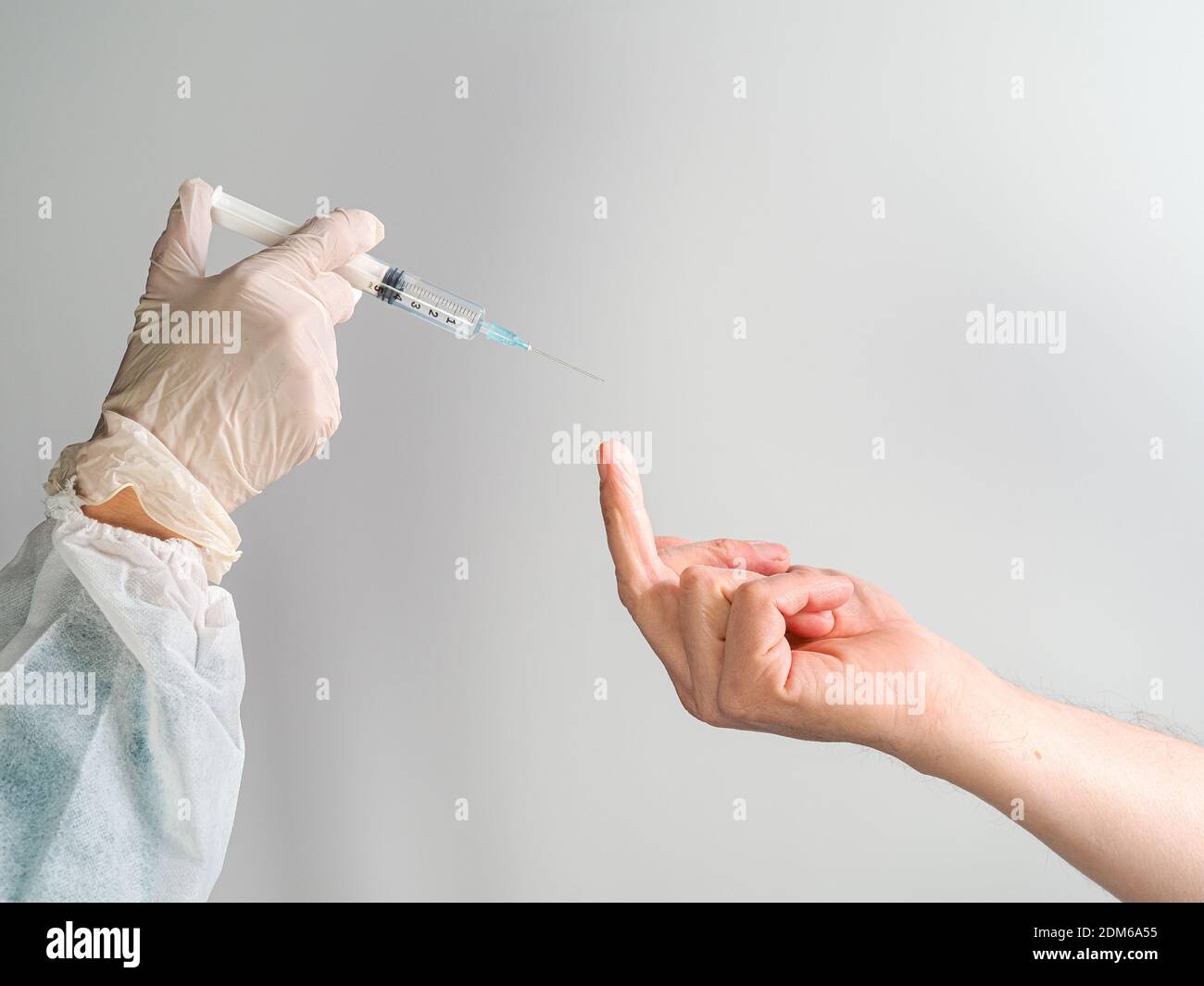 hand of nurse injecting covid-19 vaccine to patient refusal unpolite sign Stock Photo