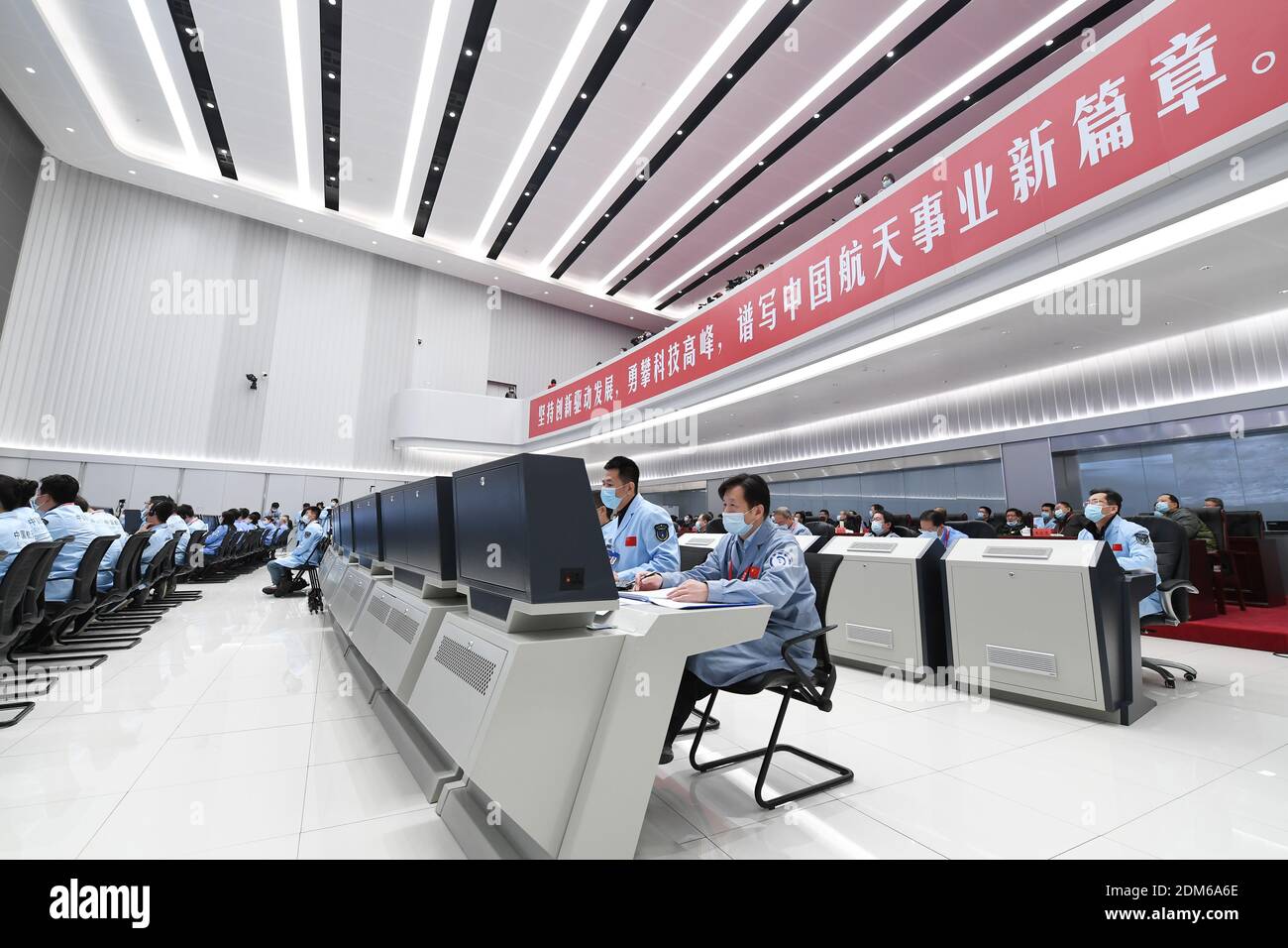 Beijing, China. 17th Dec, 2020. Technical personnel work at Beijing Aerospace Control Center in Beijing, capital of China, Dec. 17, 2020. The return capsule of China's Chang'e-5 probe touched down on Earth in the early hours of Thursday, bringing back the country's first samples collected from the moon, as well as the world's freshest lunar samples in over 40 years. Credit: Zhang Ling/Xinhua/Alamy Live News Stock Photo