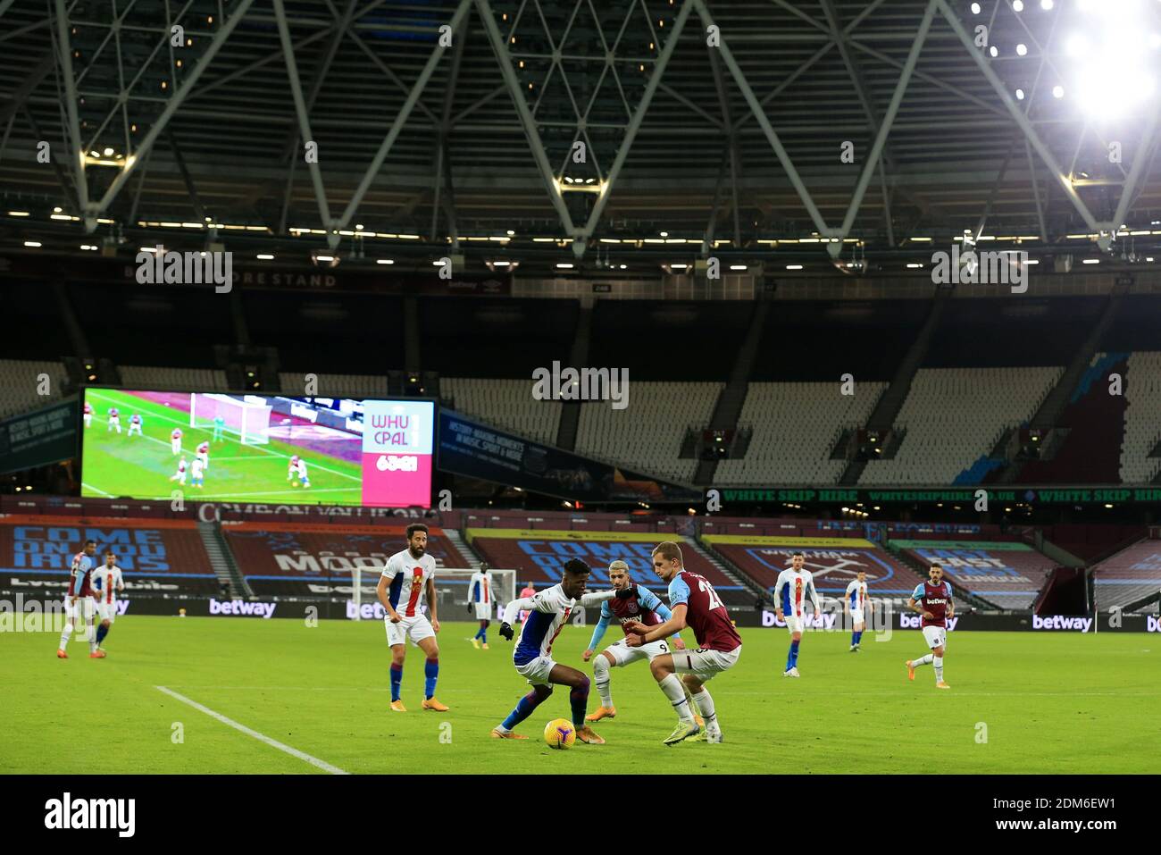 Action in front of empty stadium during the Premier League match at the London Stadium. Stock Photo