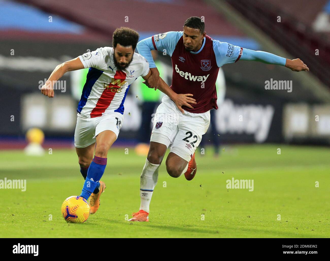 Crystal Palace's Andros Townsend and West Ham United's Sebastien Haller battle for the ball during the Premier League match at the London Stadium. Stock Photo