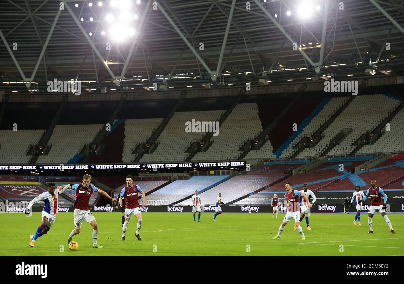 Action in front of empty stadium during the Premier League match at the London Stadium. Stock Photo