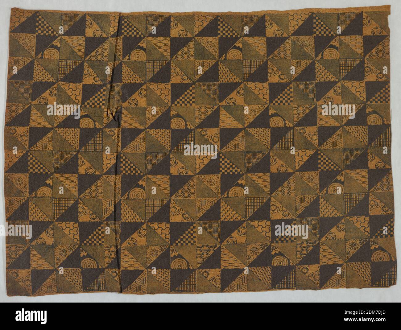 Imitation leather, Fiber composition impregnated with tung oil, embossed and painted, Repeating design made up of adjoining small triangles, some filled in with solid color, the others ornamented with small geometrical figures and flower designs. Dark brown and gray on yellowish ground., Japan, ca. 1885, Wallcoverings, Imitation leather Stock Photo