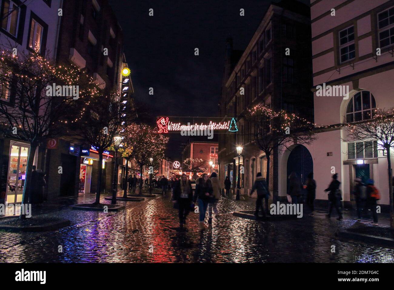 Street shot of Dusseldorf at night in winter around Christmastime Stock Photo