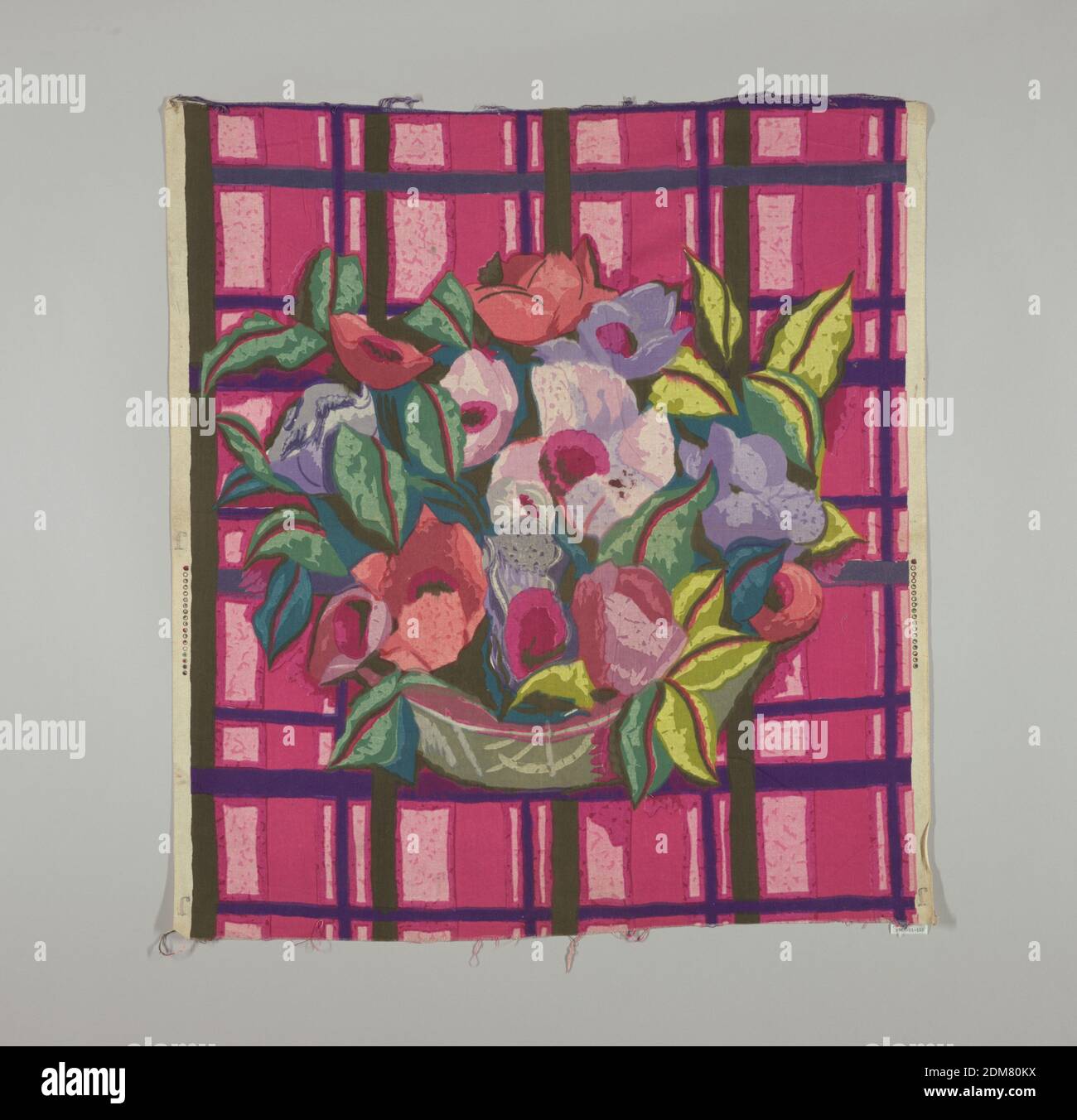 Textile, Medium: cotton Technique: block printed, Multicolored block print of a grey-green bowl with large red, pink and lavender flowers with leaves in two shades of green. Bowl is placed on a plaid-like ground of deep pink, dark purple, and black., England or USA, 1920–1930, printed, dyed & painted textiles, Textile Stock Photo
