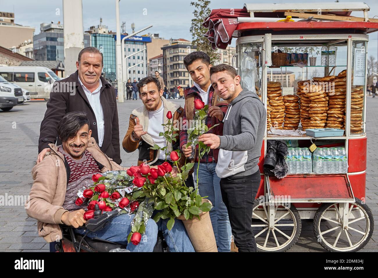 Group portrait of several young guys and one elderly man near stall with  turkish bagel at Taksim in Beyoglu, Istanbul Stock Photo - Alamy