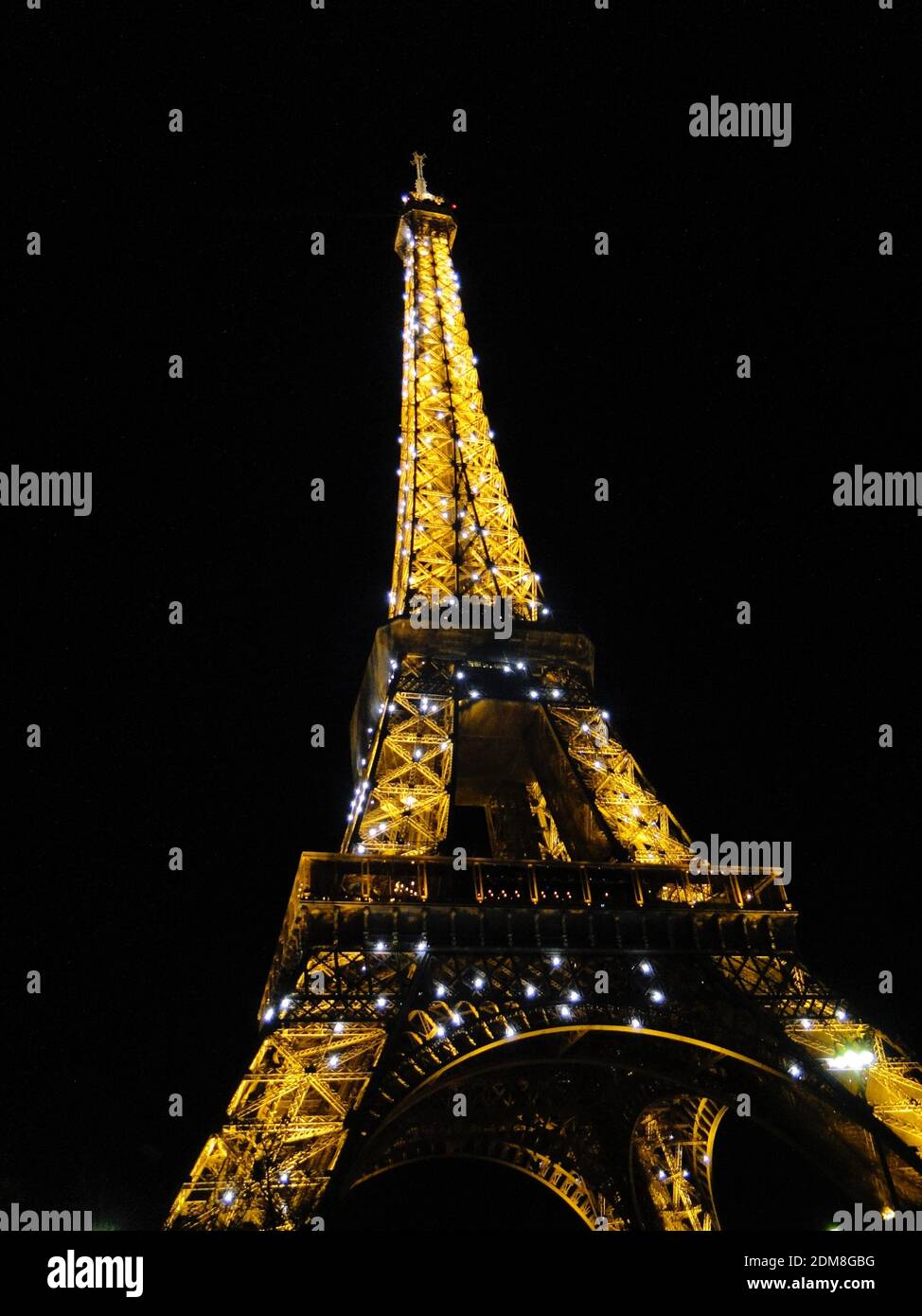the Iconic Eiffel tower in Paris at night, lit up Stock Photo Alamy