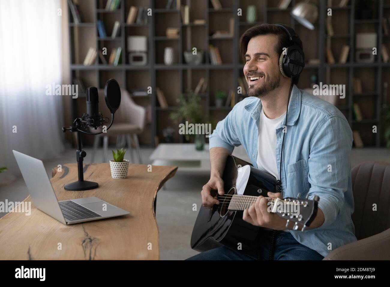 Banner view of happy man learn play guitar Stock Photo