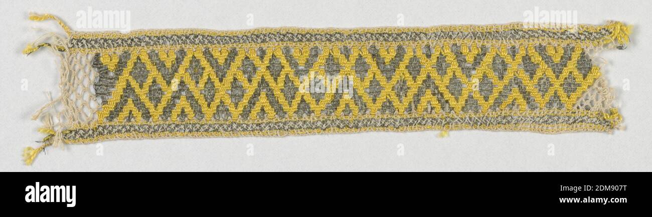 Fragment, Medium: silk, cotton, linen, metallic thread Technique: bobbin lace (?) probably machine, Straight border with an allover design of small diamonds within zigzags. Scaled and with wide slits in silver on a yellow silk ground., 19th century, trimmings, Fragment Stock Photo