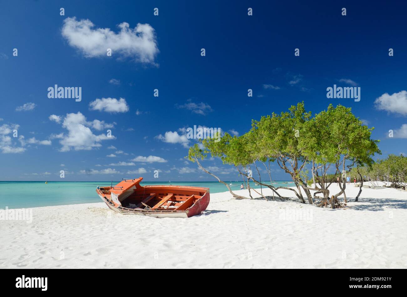 Pieces of an old boat resting at the sand in Palm Beach, Aruba Stock Photo