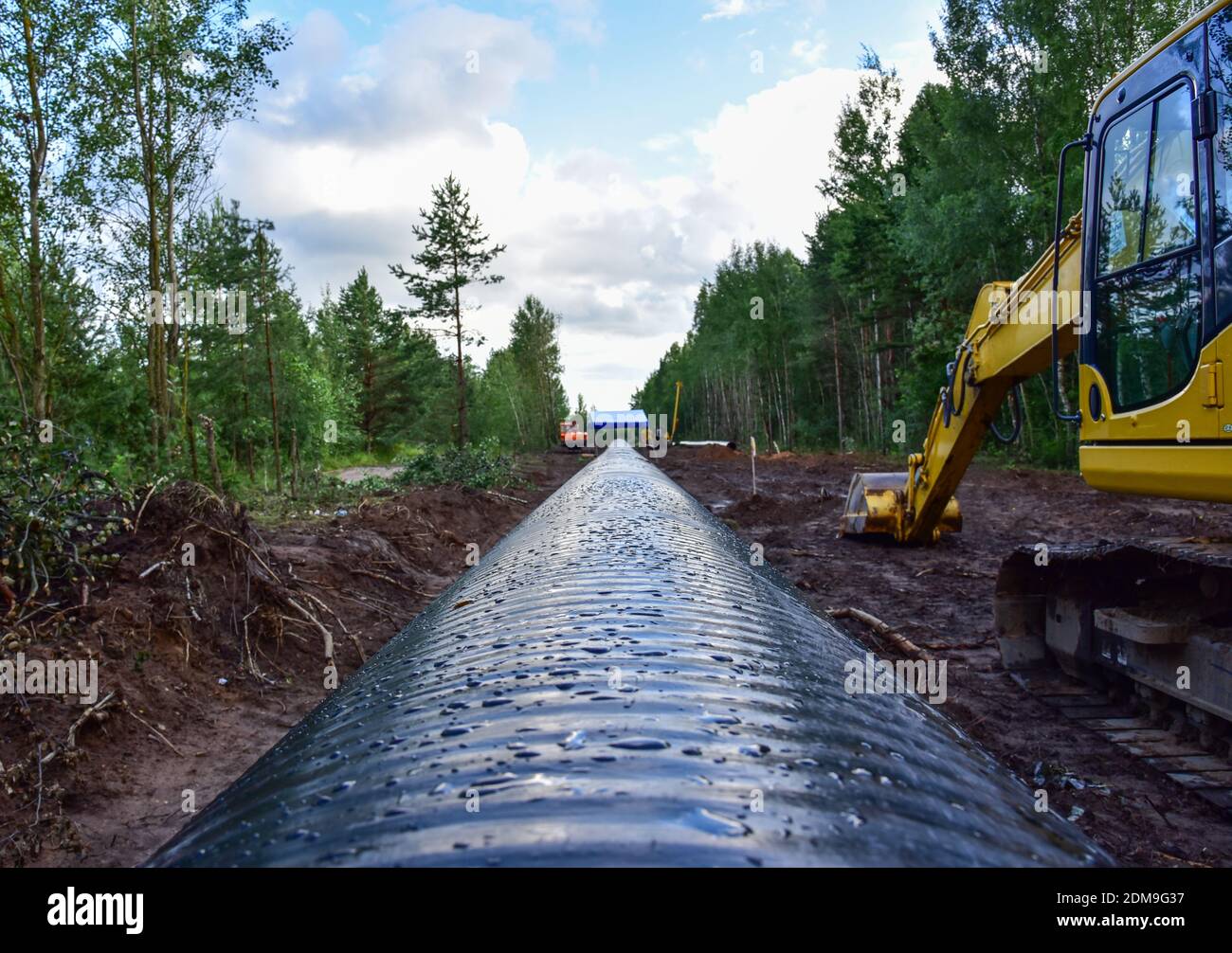 Excavator during earthwork for laying Crude oil and Natural gas 