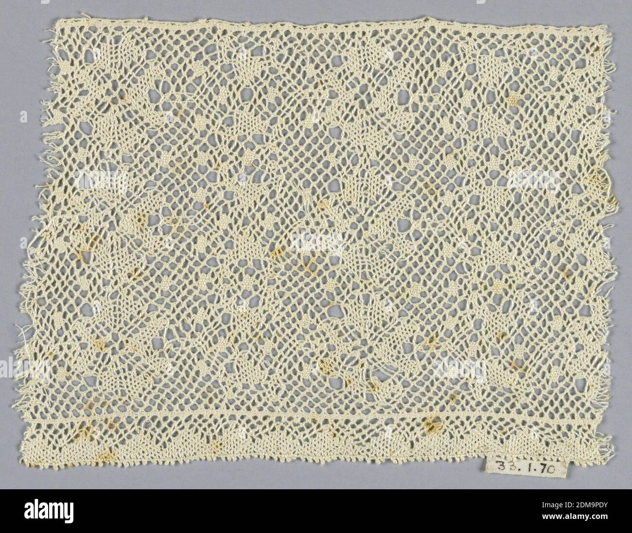 Fragment, Medium: linen Technique: bobbin lace made in Lille style with twisted ground and NO heavy outlining thread, This has a torchon ground which is two pairs passing through each other and followed by twisting., Northern Italy, 19th century, lace, Fragment Stock Photo