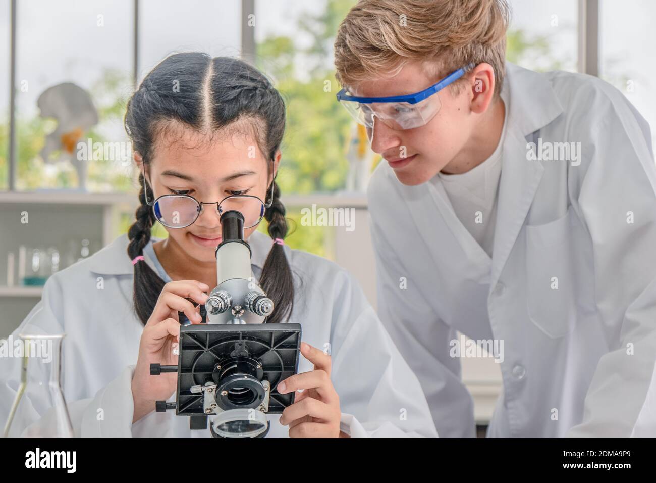 Two girls doing science experiment hi-res stock photography and images ...