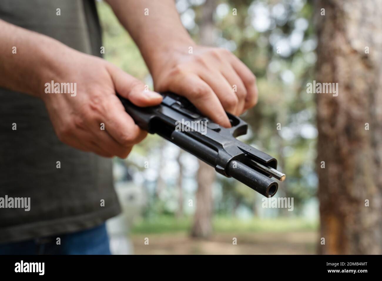 Man reloads the gun hi-res stock photography and images - Alamy