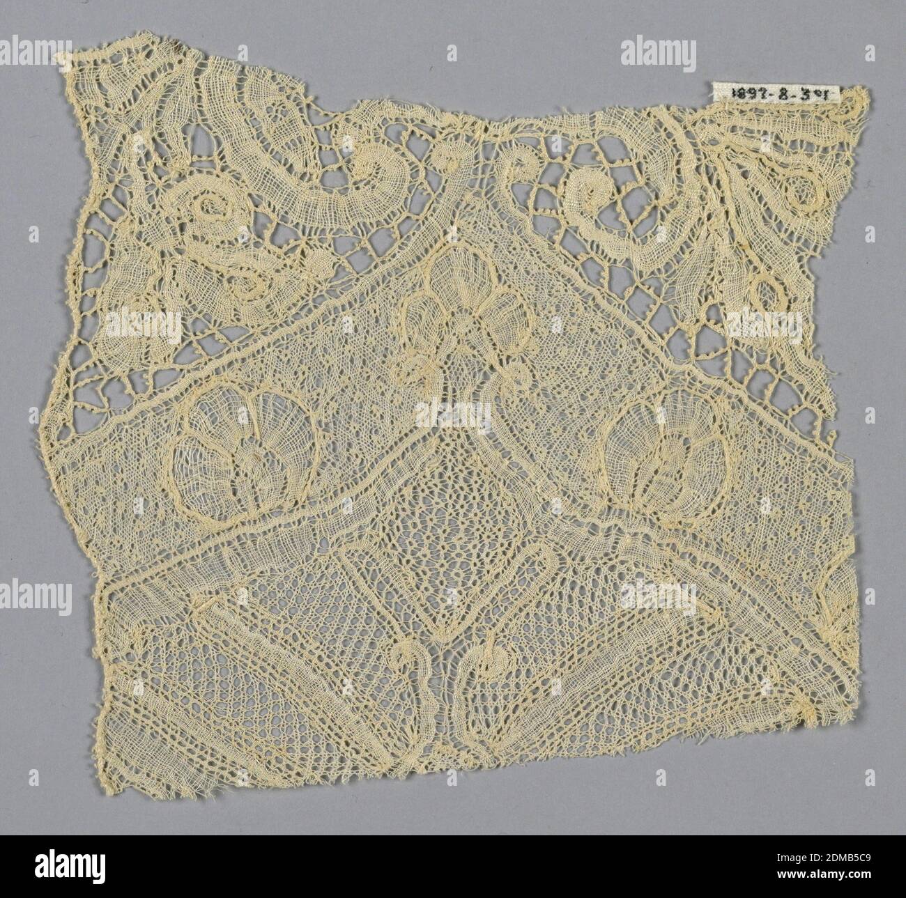 Fragment, Medium: linen Technique: bobbin lace (Brussels-style), Fragment has an incomplete large-scale floral design with varied patterns of ground mesh., Belgium, 18th century, lace, Fragment Stock Photo