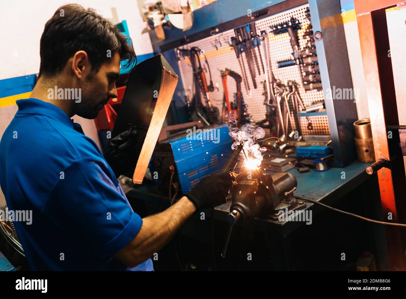 Professional Mechanic welding in Garage Stock Photo Alamy