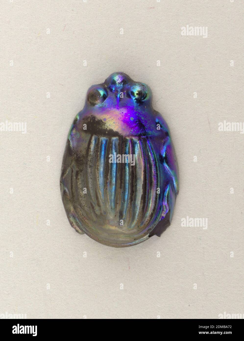 Scarab, Tiffany & Company, American, established 1853, Mold-blown favrile glass, Scarab of blue glass with peacock-blue iridescent back., New York, New York, USA, ca. 1910, jewelry, Decorative Arts, Scarab Stock Photo