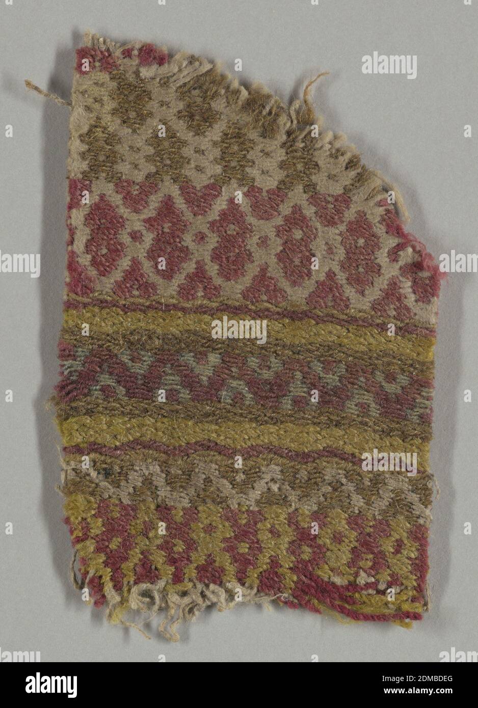 Textile, Medium: wool, linen Technique: complementary weft, Coarse wool and hand-spun linen in brown, yellow, red, and white. Patterning of simple geometric bands and lozenges. Patterned by weft floats that hide warps entirely. Heavy woolen wefts used two at a time in contrasting colors rise from the face to back of fabric in a compound weft satin., Sweden, 19th century, woven textiles, Textile Stock Photo