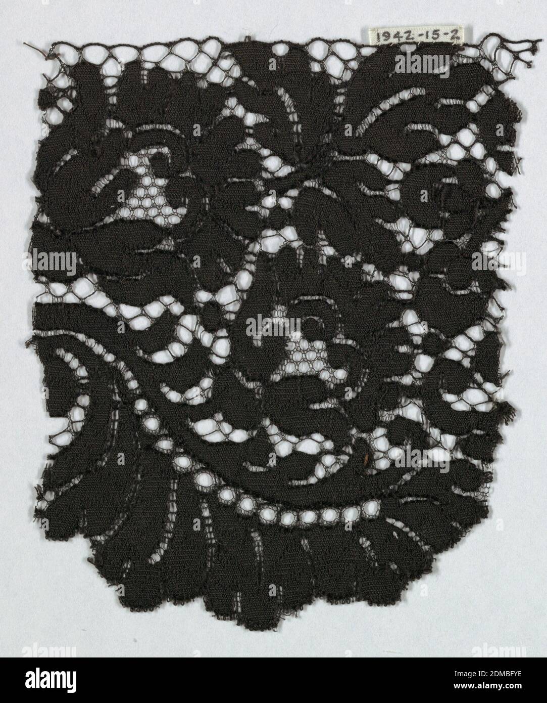 Fragment, Medium: silk Technique: machine made, Black Spanish blonde guipure lace; pattern of flowers and leaves and no ground., Spain, ca. 1850, lace, Fragment Stock Photo