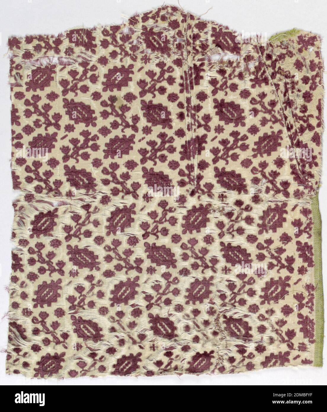 Fragment, Medium: silk Technique: cut and uncut supplementary warp pile in a five-harness satin foundation (ciselé voided velvet), Rows of diagonally aligned motifs in dull purple on an ivory voided ground. One motif is an elaborate lozenge, the other a flowering vine wrapped on a rod. The diagonal alignment is reversed from row to row; interspaces are filled with tiny rosettes., 17th century, woven textiles, Fragment Stock Photo