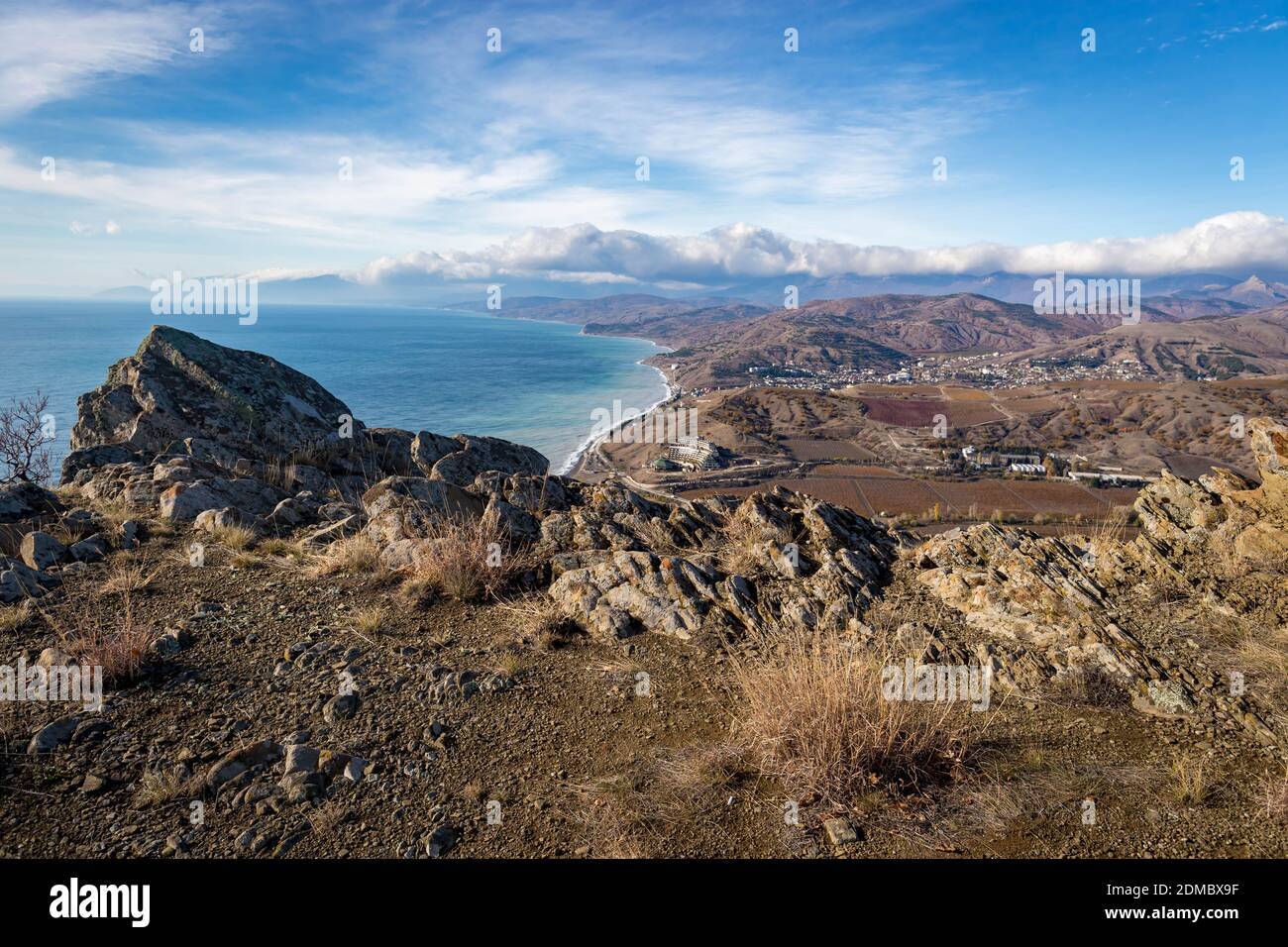 Scenic View Of Sea And Mountains Against Sky Stock Photo