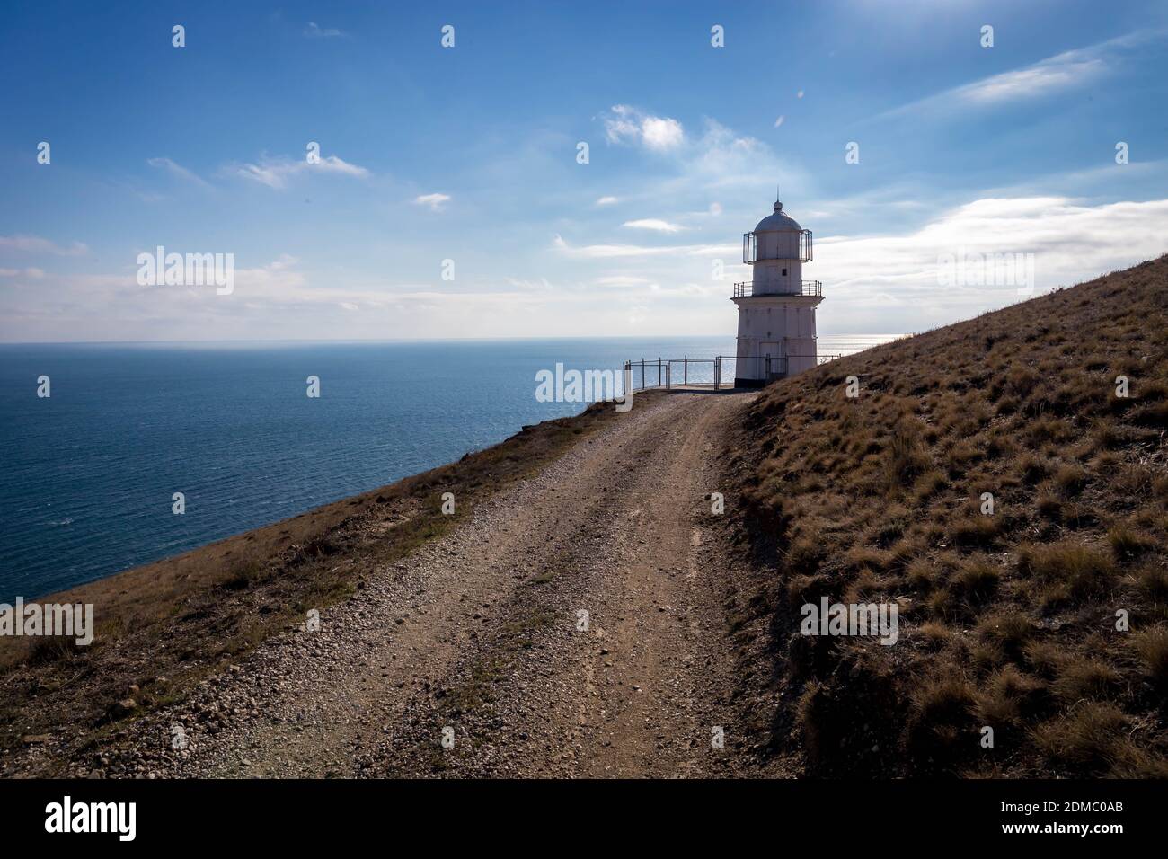 Lighthouse By Sea Against Sky Stock Photo