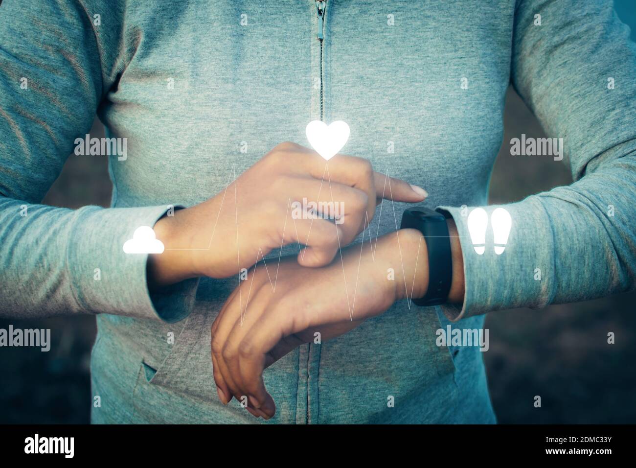 Midsection Woman Using Smart Watch With Digital Icons Stock Photo