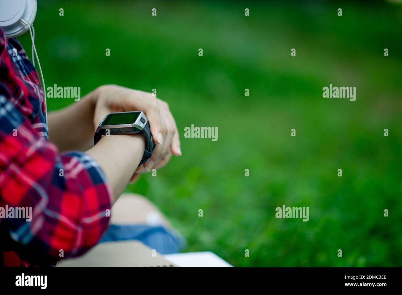 The Girl Watches The Watch In Hand Watches The Time In A Black Watch