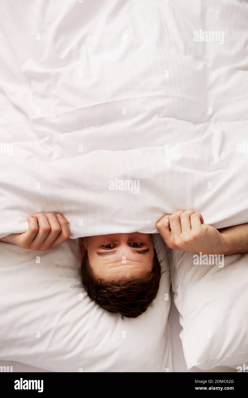 Man hiding under sheet hires stock photography and images Alamy
