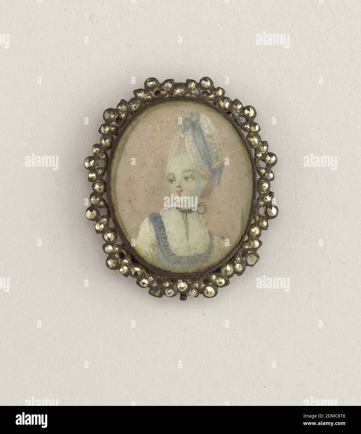 Ornament, Painted paper, glass, cut steel, Miniature portrait of a lady painted in watercolor on paper and carved with glass, mounted in frame of cut steel. On the back at the top and bottom is a curved piece of steel pierced by six holes., France, 19th century, miniatures, Decorative Arts, Ornament Stock Photo