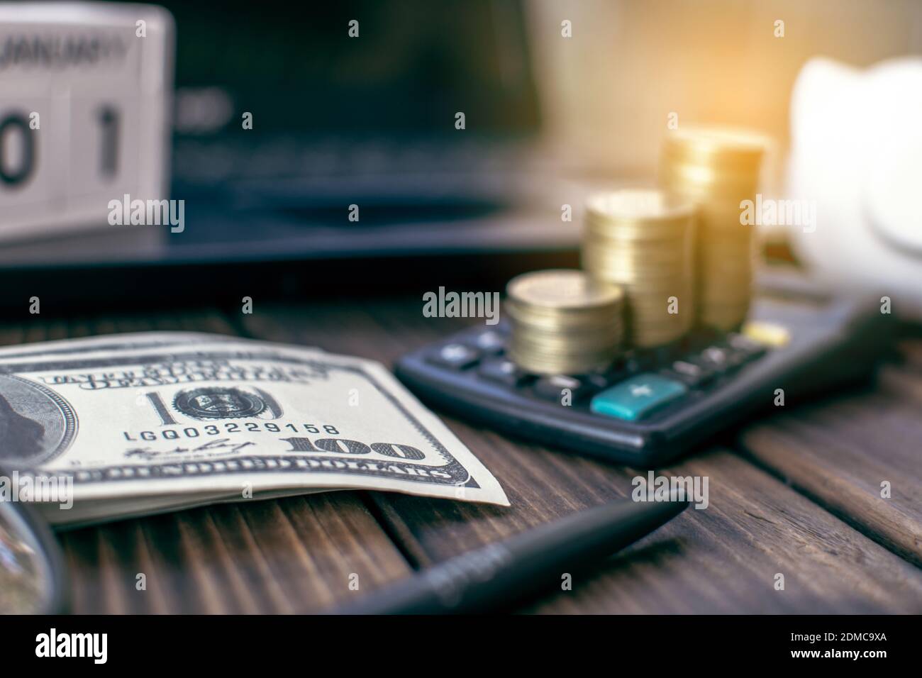 Close-up Of Currency And Calculator On Table Stock Photo