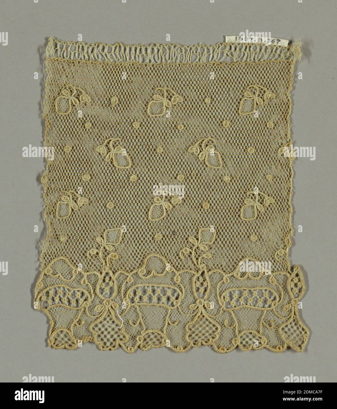 Fragment, Medium: linen Technique: needle lace, Fragment showing powdered dots and berries. Lower border has a repeat of baskets., France, late 18th century, lace, Fragment Stock Photo